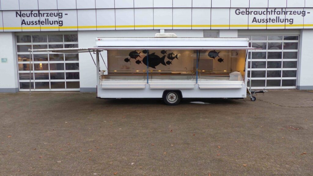Verkaufsklappe an Heckseite über ganze Tiefe mit Dachecke als Verbindung zur Verkaufsklappe längsseitig.--Der Verkauf des Fahrzeuges erfolgt zum Sonderpreis nur im Ist-Zustand.-Instandsetzungsarbeiten nur gegen Aufpreis.