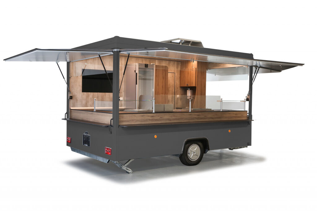 Imbissanhänger ab sofort verfügbar!-Dekore abweichend, Lackierung in RAL 7024 graphitgrau-Doppelfritteuse, Bainmarie mit 3 GN-Behältern, Rostgrill und Griddlepfanne