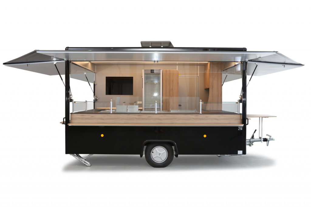 Imbissanhänger ab sofort verfügbar!-Dekore abweichend, Lackierung in RAL 9005 tiefschwarz-Doppelfritteuse, Bainmarie mit 3 GN-Behältern, Rostgrill und Griddlepfanne