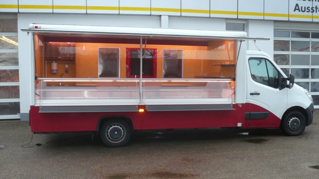 Wochenmarkt-Verkaufsmobil in gepflegtem Zustand mit Doppelstitzbank und geringer Kilometerleistung.