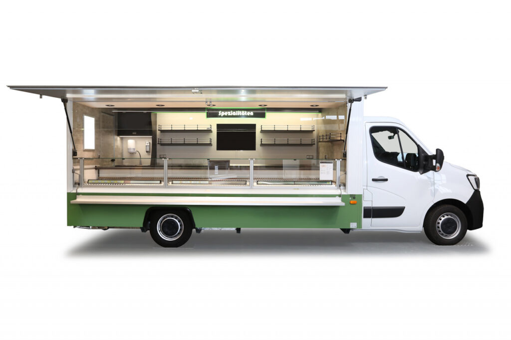 Verkaufsmobil mit Licht für Feinkostprodukte-Kühltheke mit Umluftkühlung, unterhalb der Theke ein Doppelkühlfach für 4 E-Kisten.-beleuchteter Plakatrahmen, Kassenschublade, Glaswerbetafel u.v.m.-Renault Master mit Allwetterbereifung und Klang-&Klima-Paket